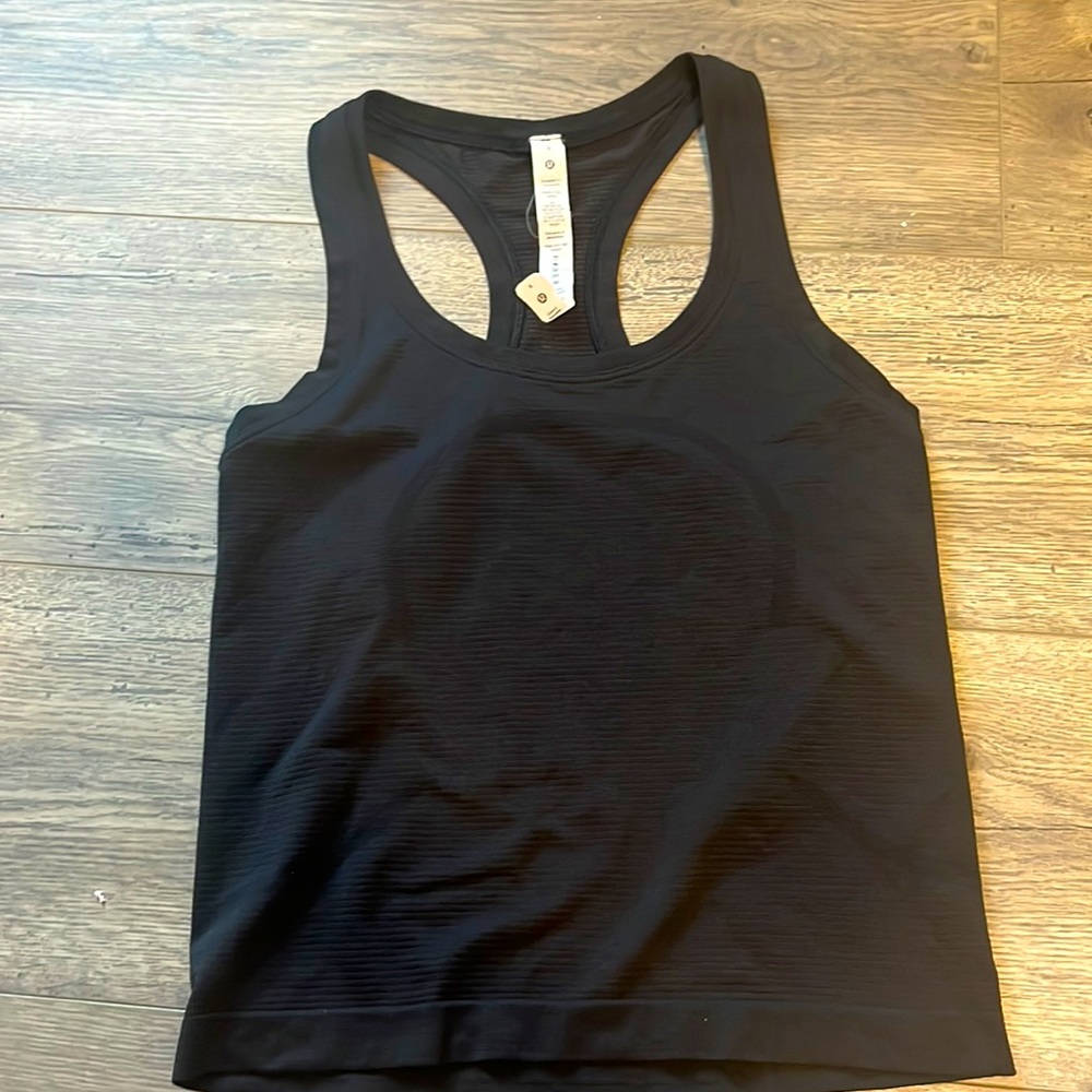 Race length swiftly tank top